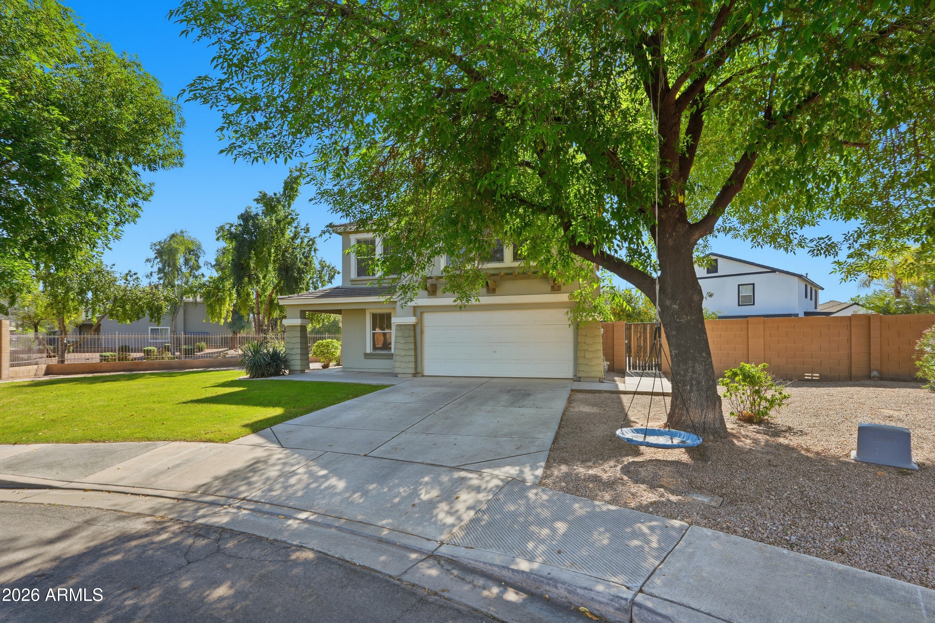 2497 East Ivanhoe Court Gilbert, AZ 85295 - Photo 2 of 57 a front view of a house with a yard and garage
