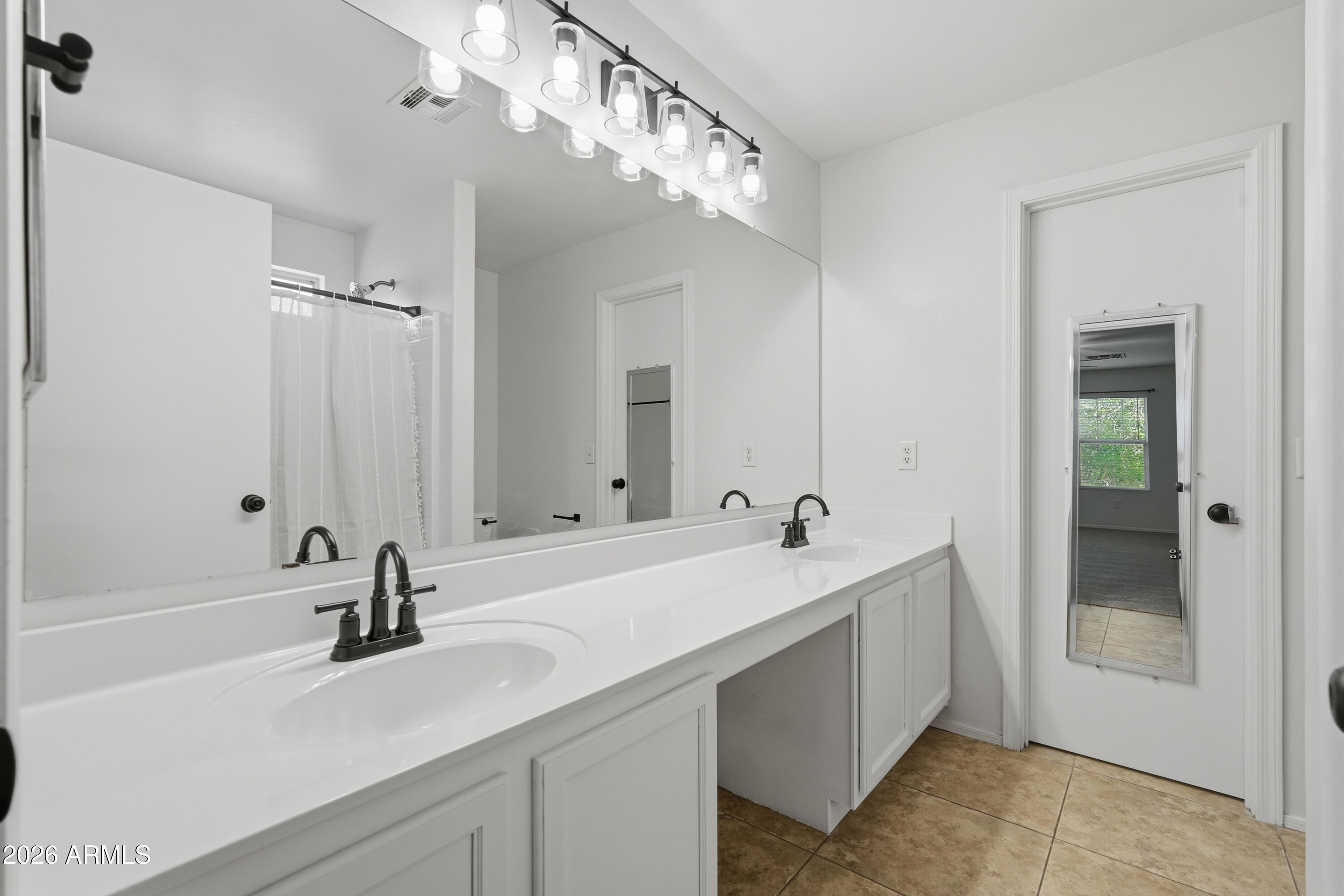 2497 East Ivanhoe Court Gilbert, AZ 85295 - Photo 35 of 57 a bathroom with a sink double vanity and a mirror