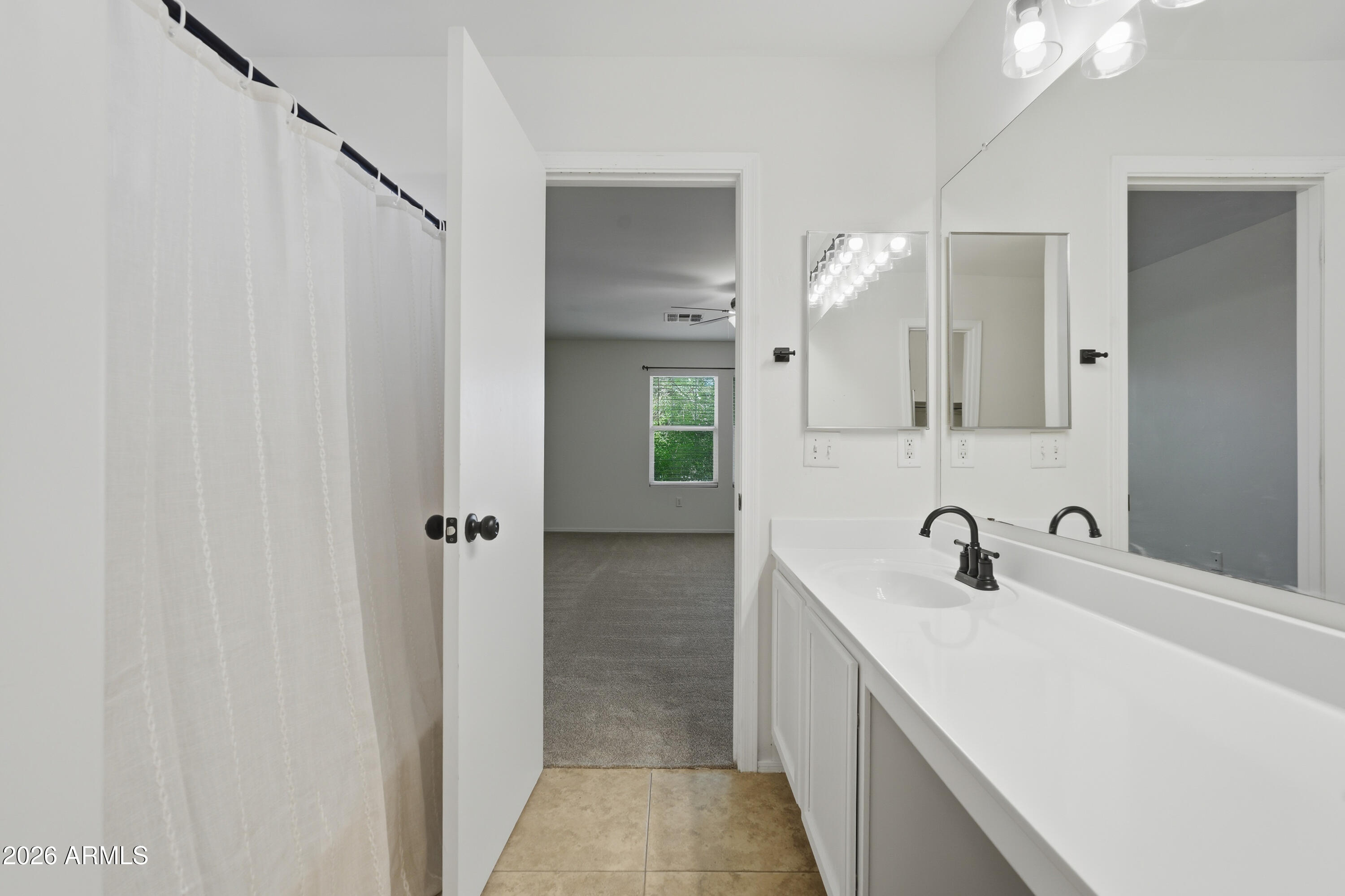 2497 East Ivanhoe Court Gilbert, AZ 85295 - Photo 36 of 57 a bathroom with a double vanity sink and mirror