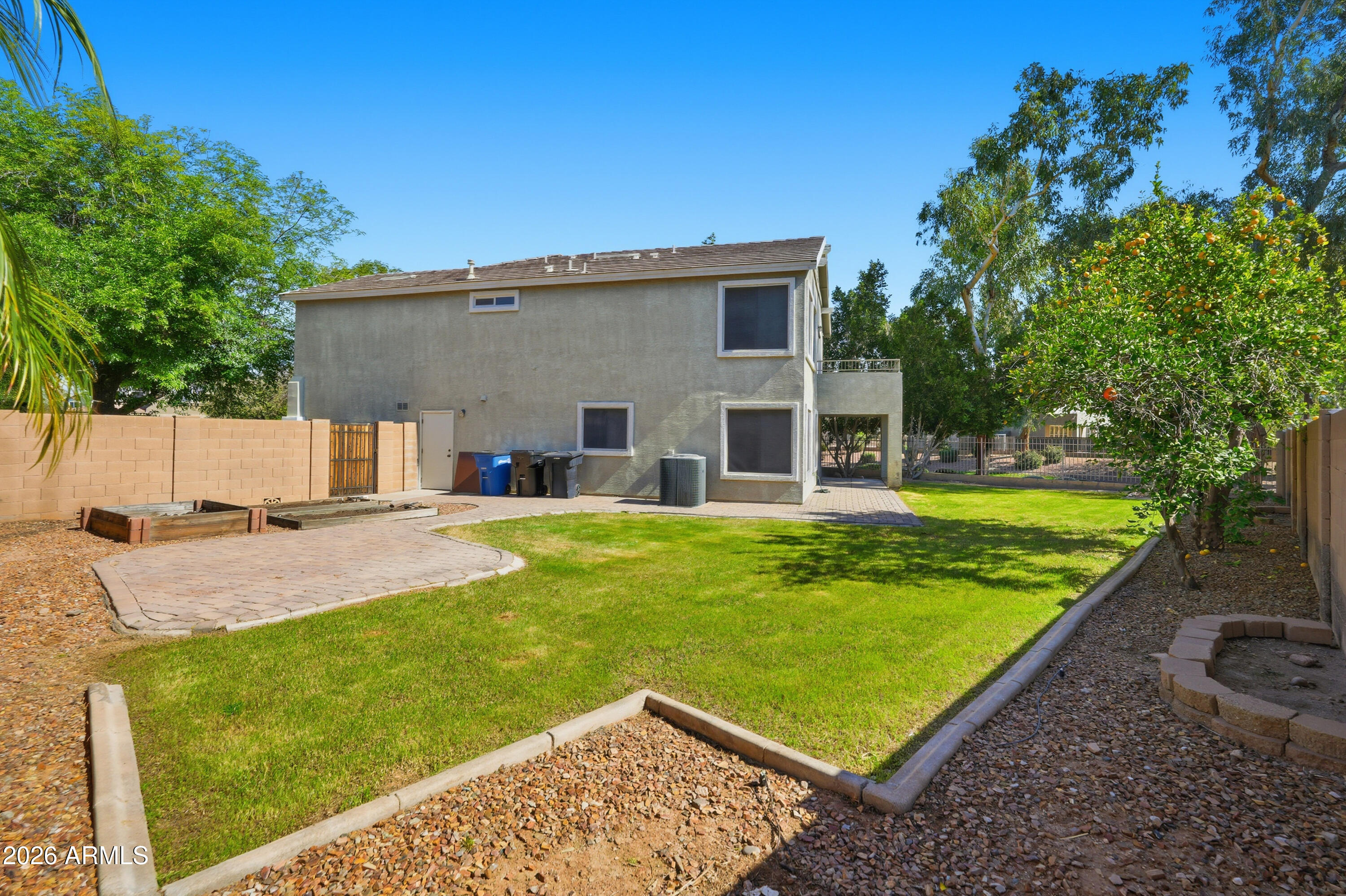 2497 East Ivanhoe Court Gilbert, AZ 85295 - Photo 47 of 57 a view of a house with swimming pool and a yard