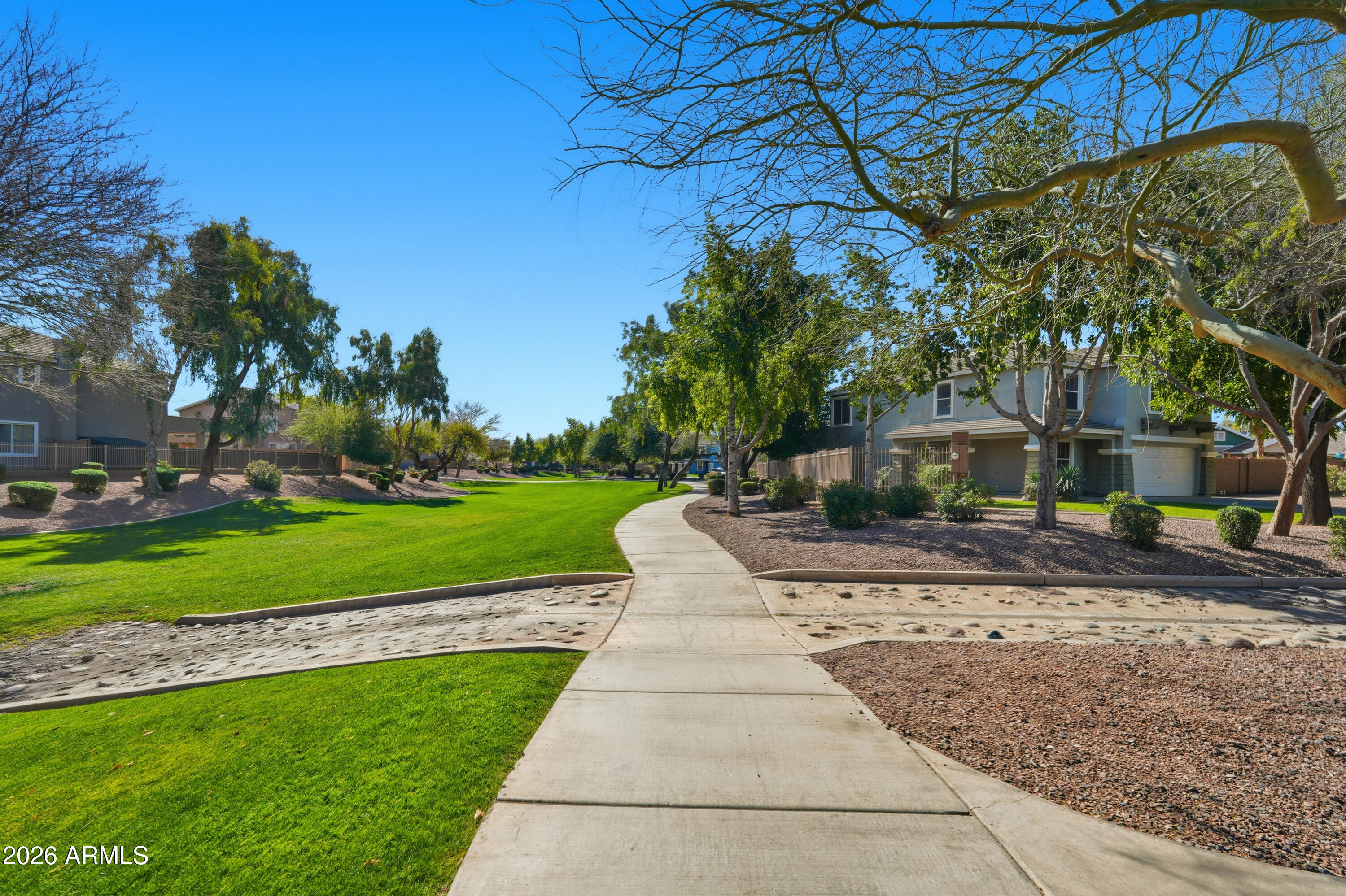2497 East Ivanhoe Court Gilbert, AZ 85295 - Photo 55 of 57 a front view of a house with a yard