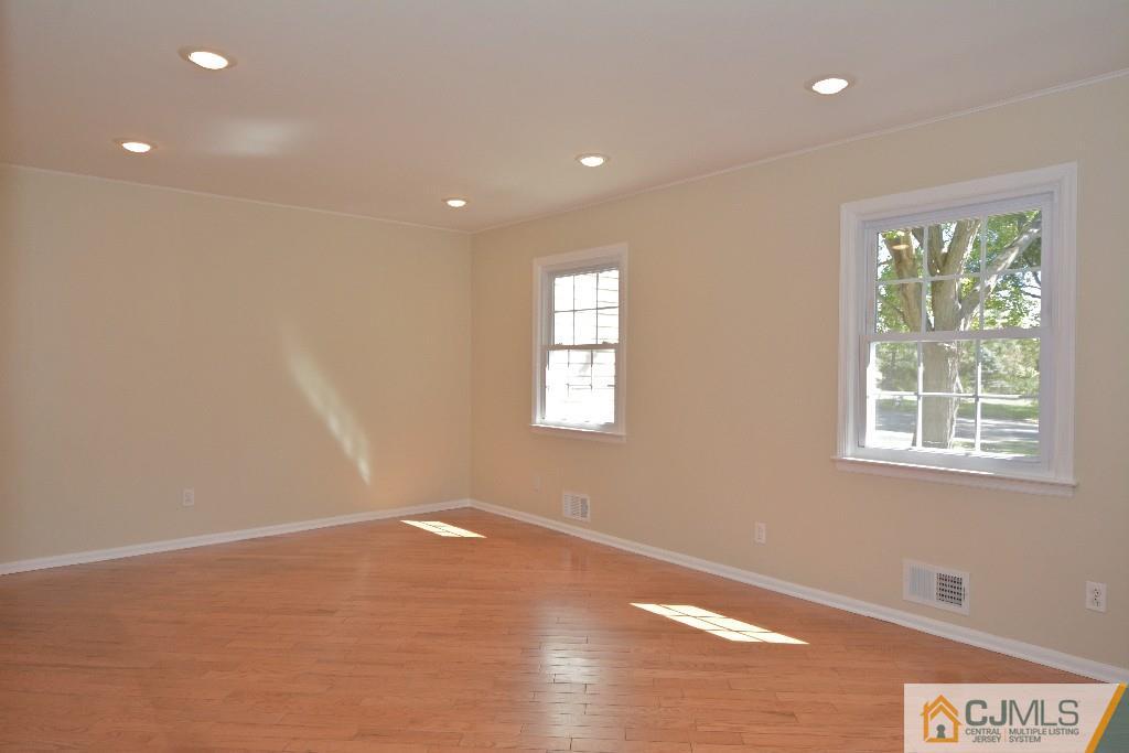 2 Taylor Road Princeton, NJ 08540 - Photo 12 of 25 a view of an empty room with wooden floor and a window