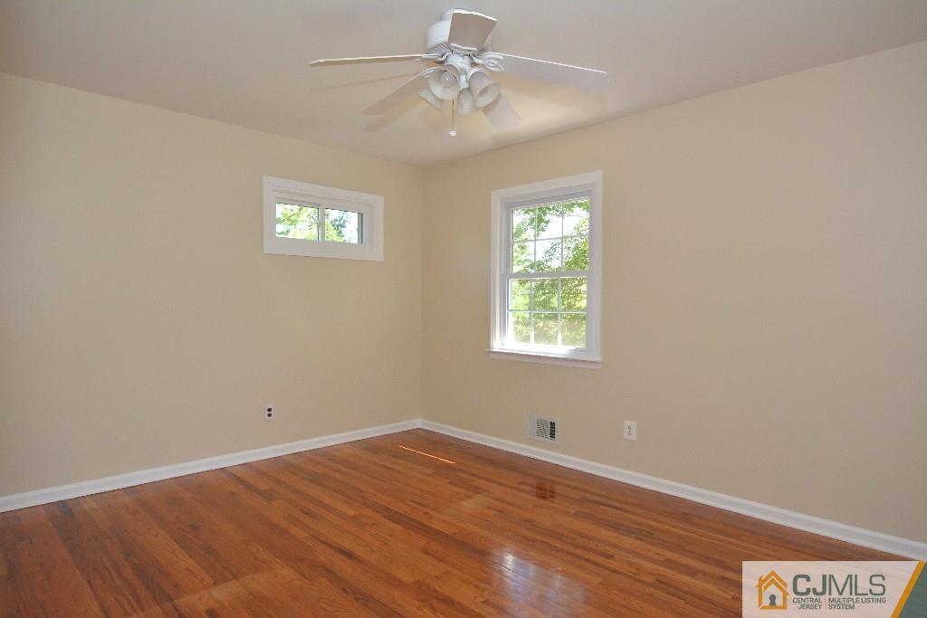 2 Taylor Road Princeton, NJ 08540 - Photo 16 of 25 an empty room with a window and a ceiling fan