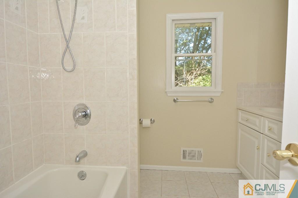 2 Taylor Road Princeton, NJ 08540 - Photo 19 of 25 a bath tub sitting next to a window