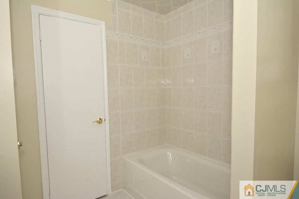 2 Taylor Road Princeton, NJ 08540 - Photo 21 of 25 a white bath tub sitting next to a shower