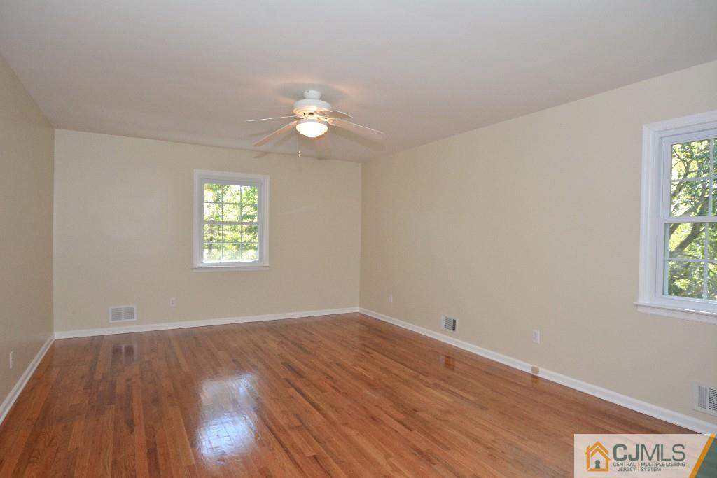 2 Taylor Road Princeton, NJ 08540 - Photo 22 of 25 an empty room with wooden floor and windows