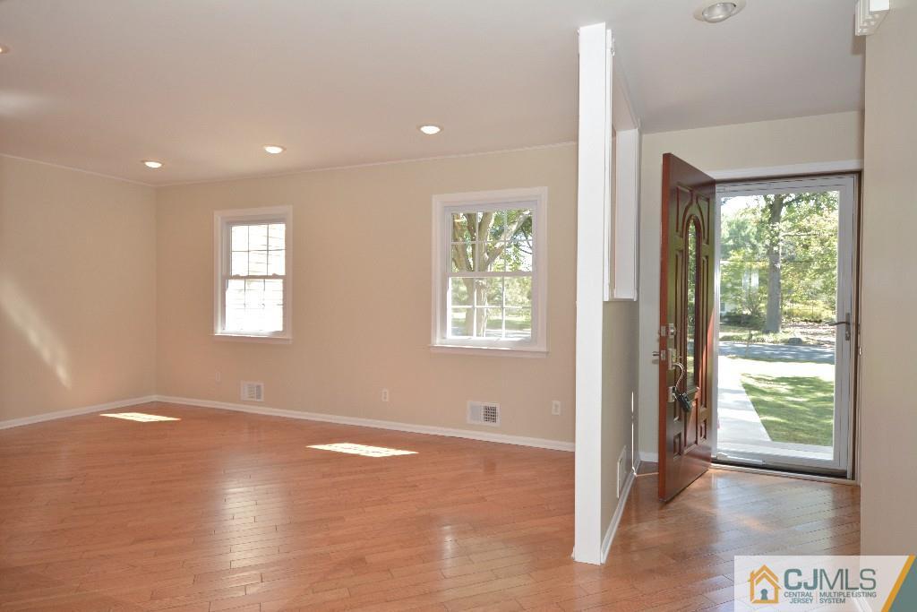 2 Taylor Road Princeton, NJ 08540 - Photo 4 of 25 a view of an empty room with wooden floor and a window
