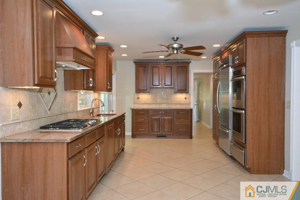 2 Taylor Road Princeton, NJ 08540 - Photo 8 of 25 a kitchen with stainless steel appliances a refrigerator and a stove