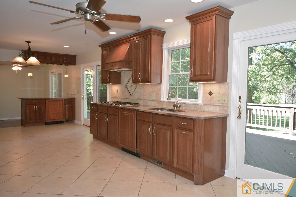2 Taylor Road Princeton, NJ 08540 - Photo 9 of 25 a bathroom with a granite countertop sink two mirror and a window