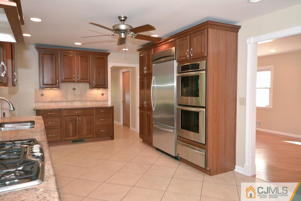 2 Taylor Road Princeton, NJ 08540 - Photo 10 of 25 a kitchen with stainless steel appliances kitchen island granite countertop a refrigerator and a sink
