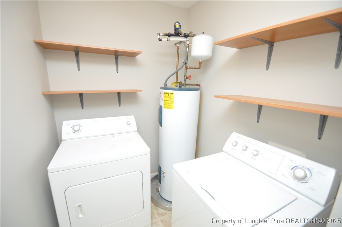 8600 Neuse Landing Lane, Unit 101 Raleigh, NC 27616 - Photo 14 of 29 a utility room with dryer and washer