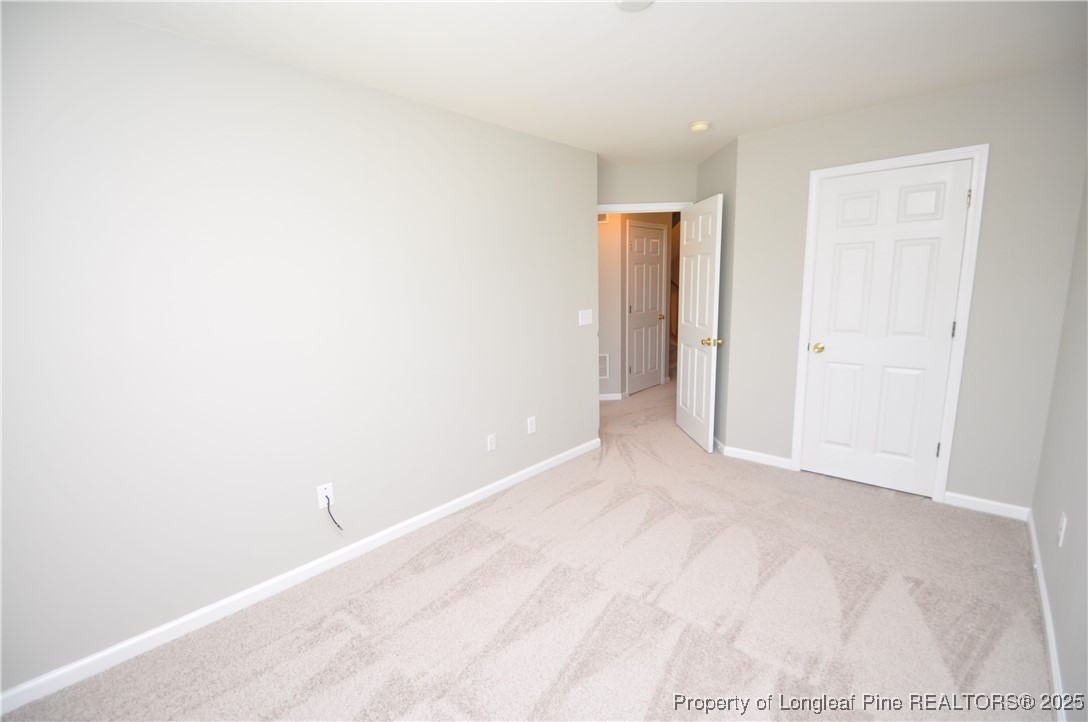 8600 Neuse Landing Lane, Unit 101 Raleigh, NC 27616 - Photo 17 of 29 a view of an empty room