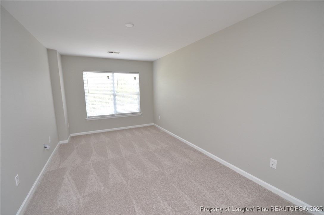 8600 Neuse Landing Lane, Unit 101 Raleigh, NC 27616 - Photo 18 of 29 a view of empty room with window
