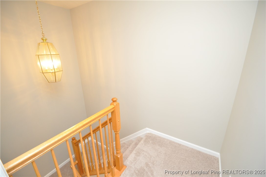 8600 Neuse Landing Lane, Unit 101 Raleigh, NC 27616 - Photo 20 of 29 a view of staircase with wooden floor