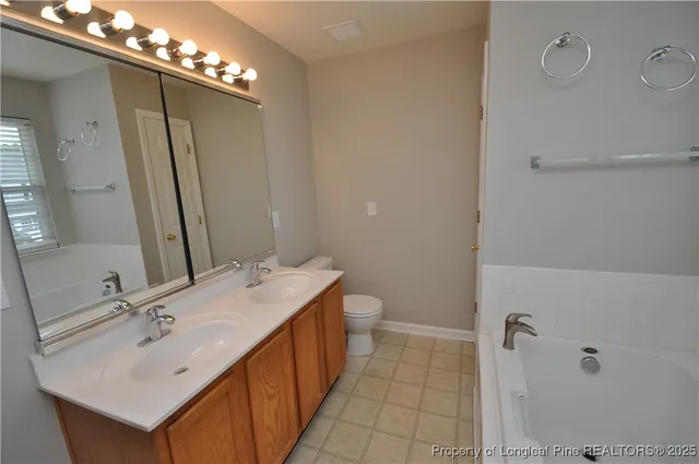 a bathroom with a sink double vanity and a mirror