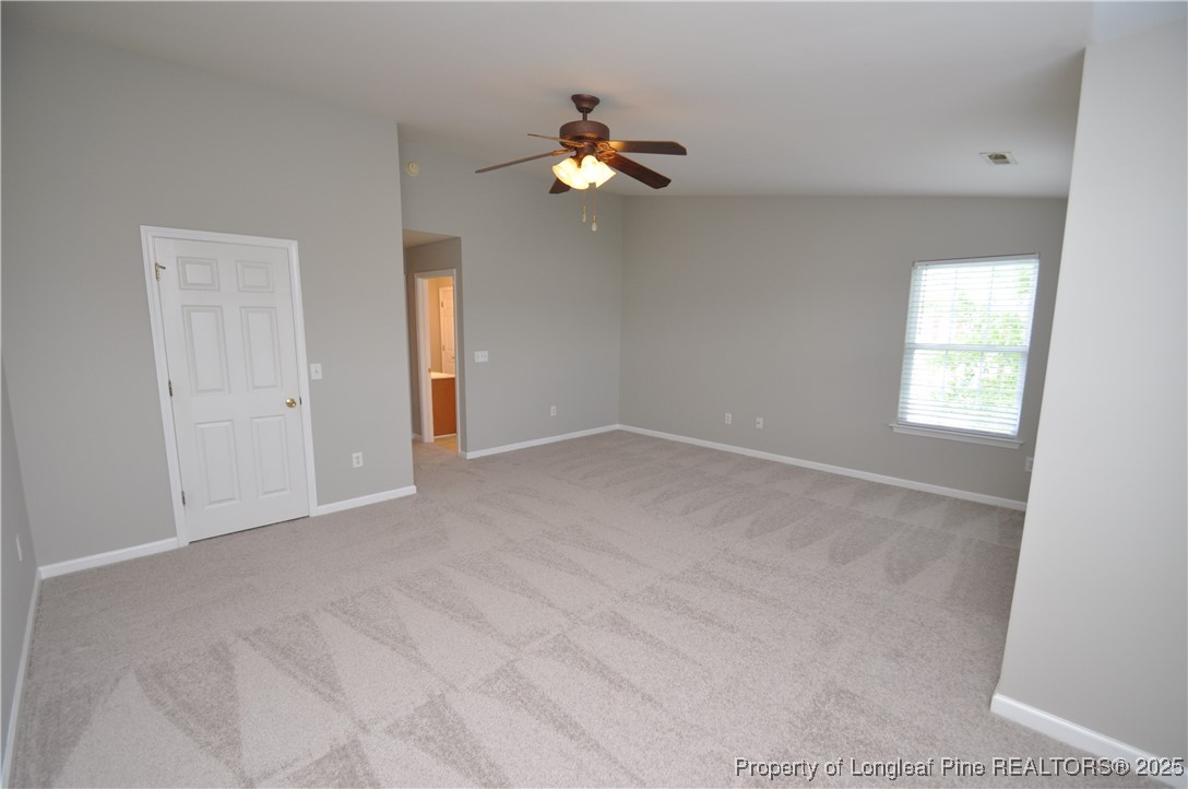 8600 Neuse Landing Lane, Unit 101 Raleigh, NC 27616 - Photo 26 of 29 wooden floor in an empty room with a window