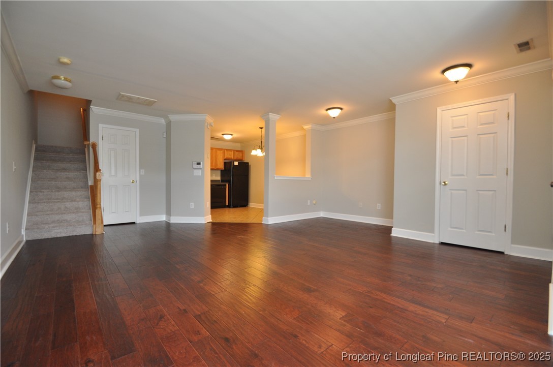 8600 Neuse Landing Lane, Unit 101 Raleigh, NC 27616 - Photo 3 of 29 a view of a hallway with wooden floor
