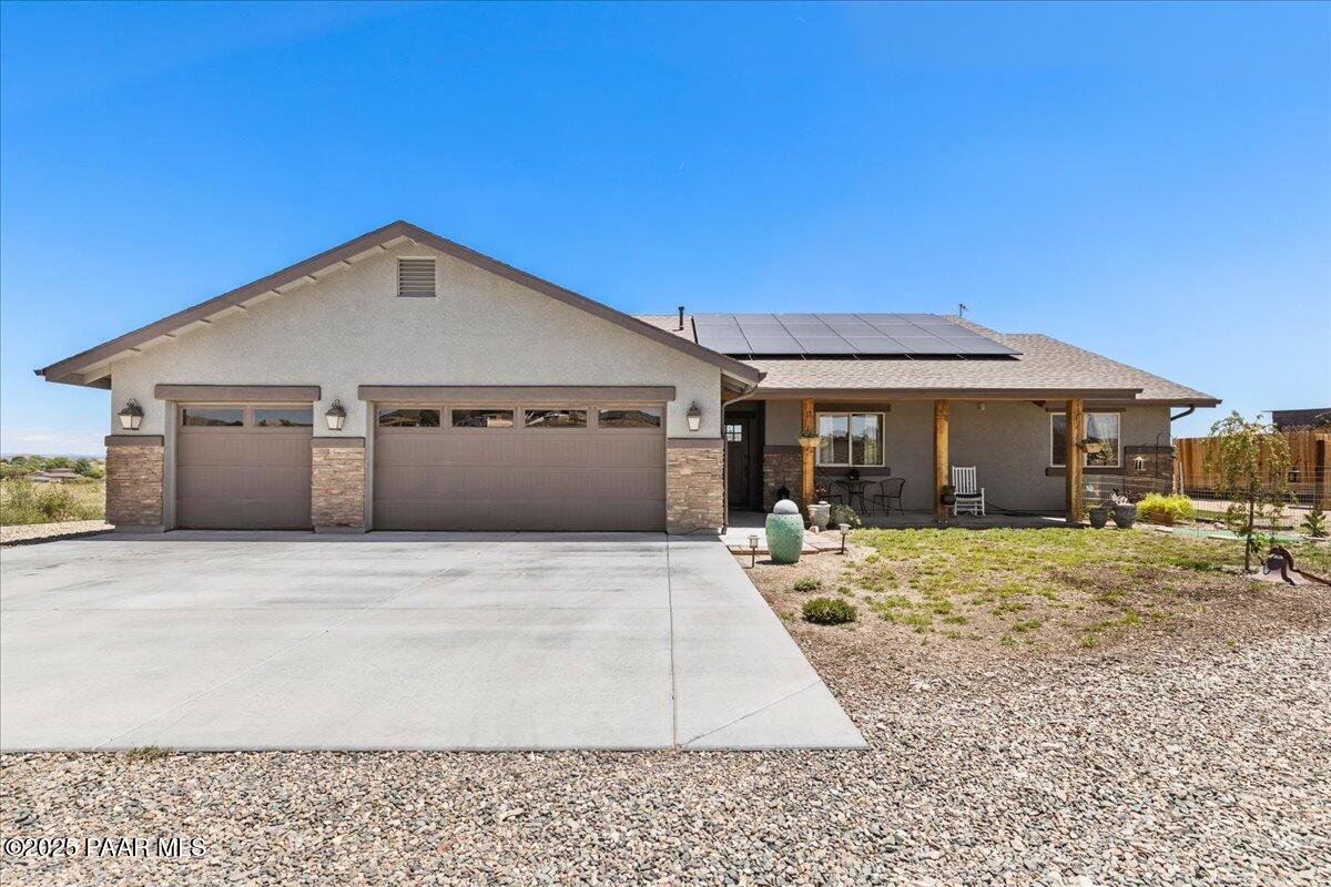 1617 Windmill Way Chino Valley, AZ 86323 - Photo 1 of 42 a front view of a house with a yard and seating space