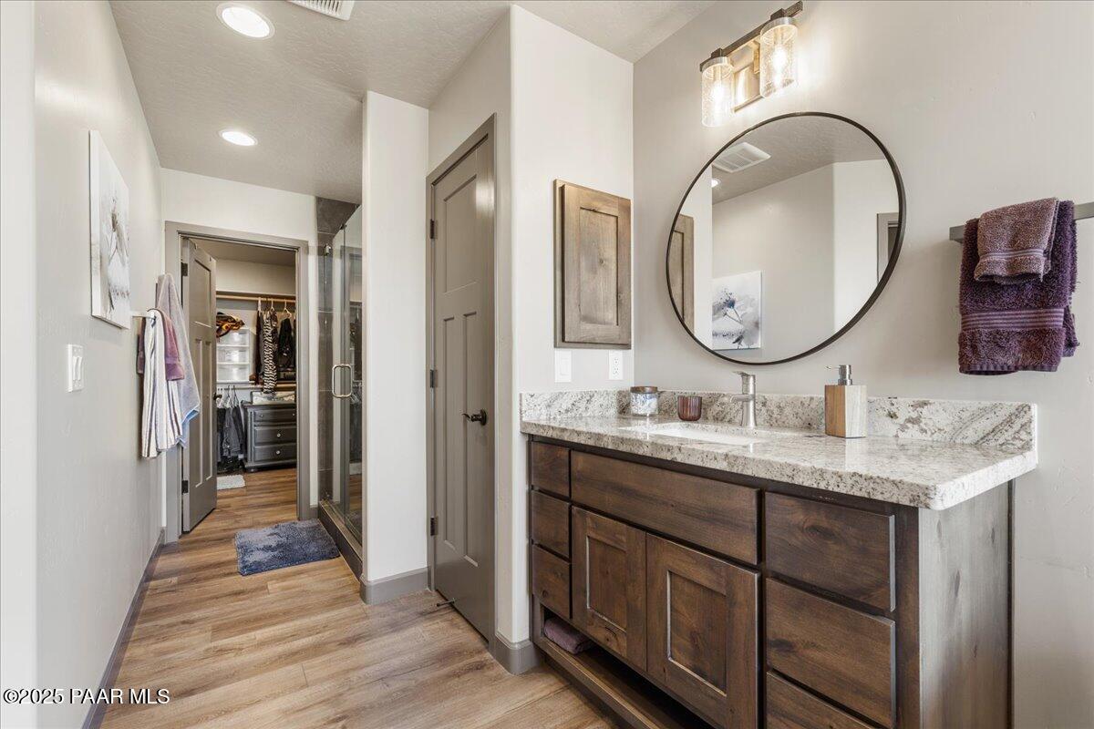 1617 Windmill Way Chino Valley, AZ 86323 - Photo 23 of 42 a en suite bathroom with a granite countertop double vanity sink and a mirror