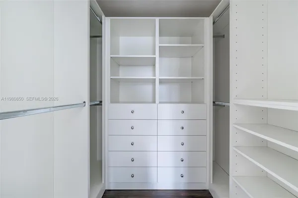 a view of an empty walk in closet