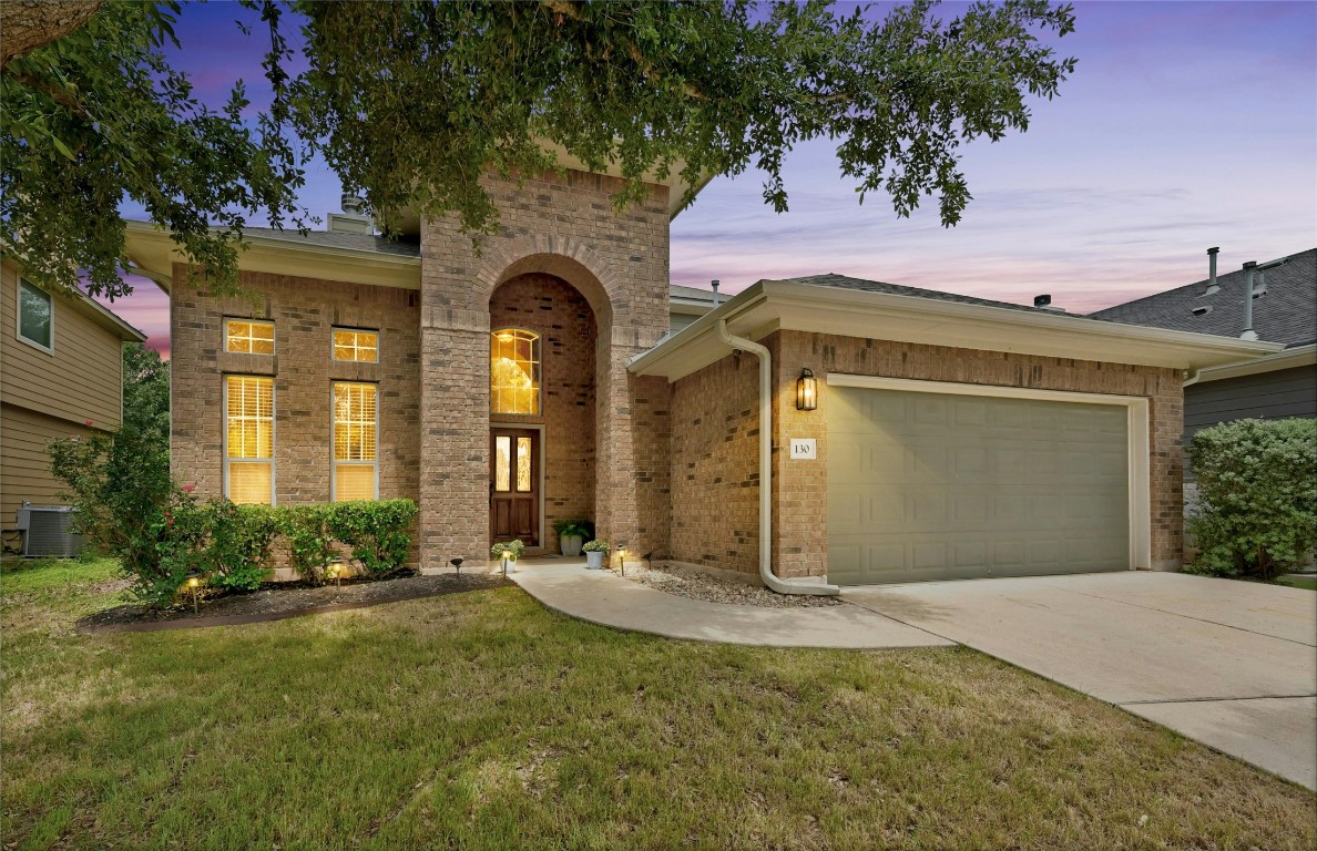 130 Farm House Road San Marcos, TX 78666 - Photo 1 of 35 a front view of a house with a yard