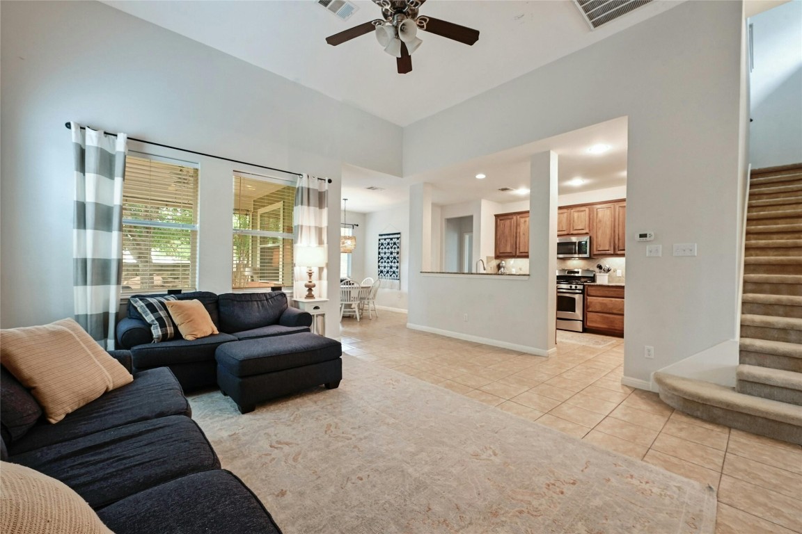 130 Farm House Road San Marcos, TX 78666 - Photo 14 of 35 a living room with furniture and a large window with kitchen view