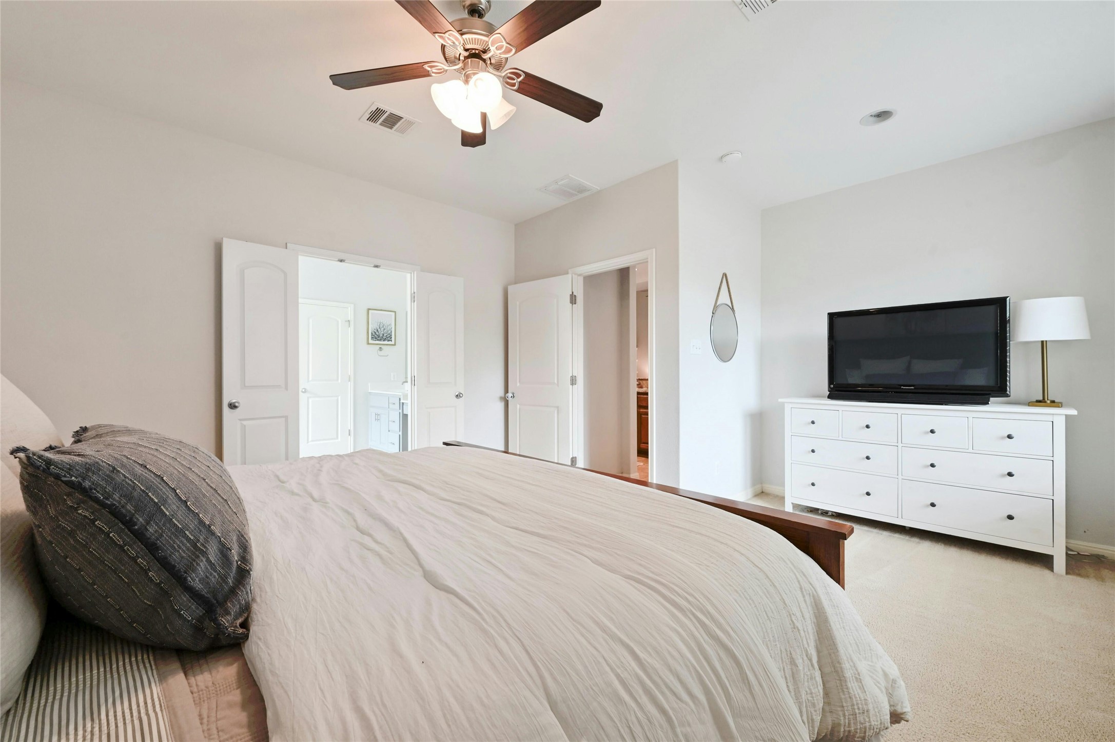 130 Farm House Road San Marcos, TX 78666 - Photo 16 of 34 a bedroom with a bed and a flat screen tv