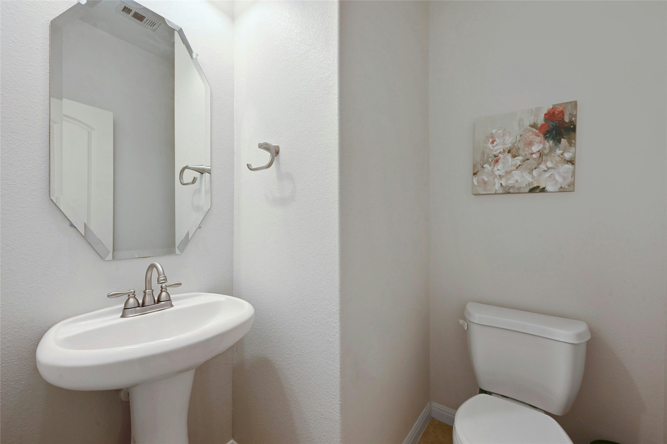 130 Farm House Road San Marcos, TX 78666 - Photo 19 of 34 a bathroom with a toilet sink and mirror