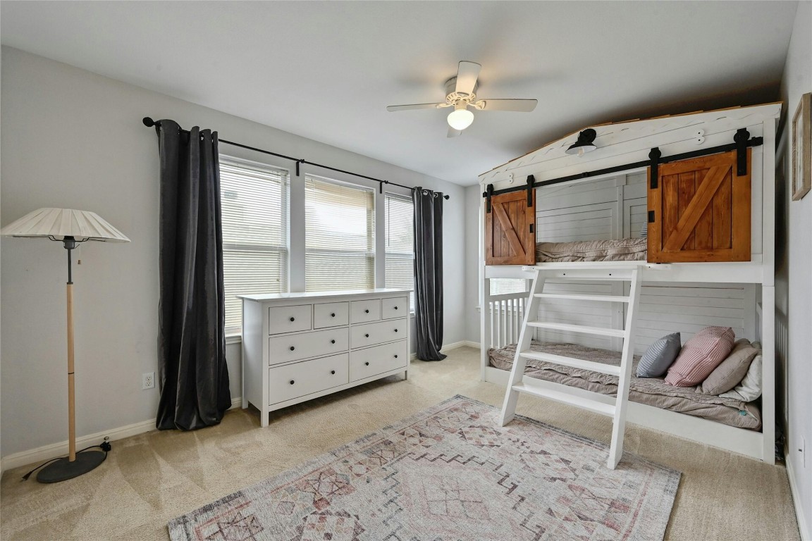 130 Farm House Road San Marcos, TX 78666 - Photo 22 of 35 a bedroom with a bed and a window