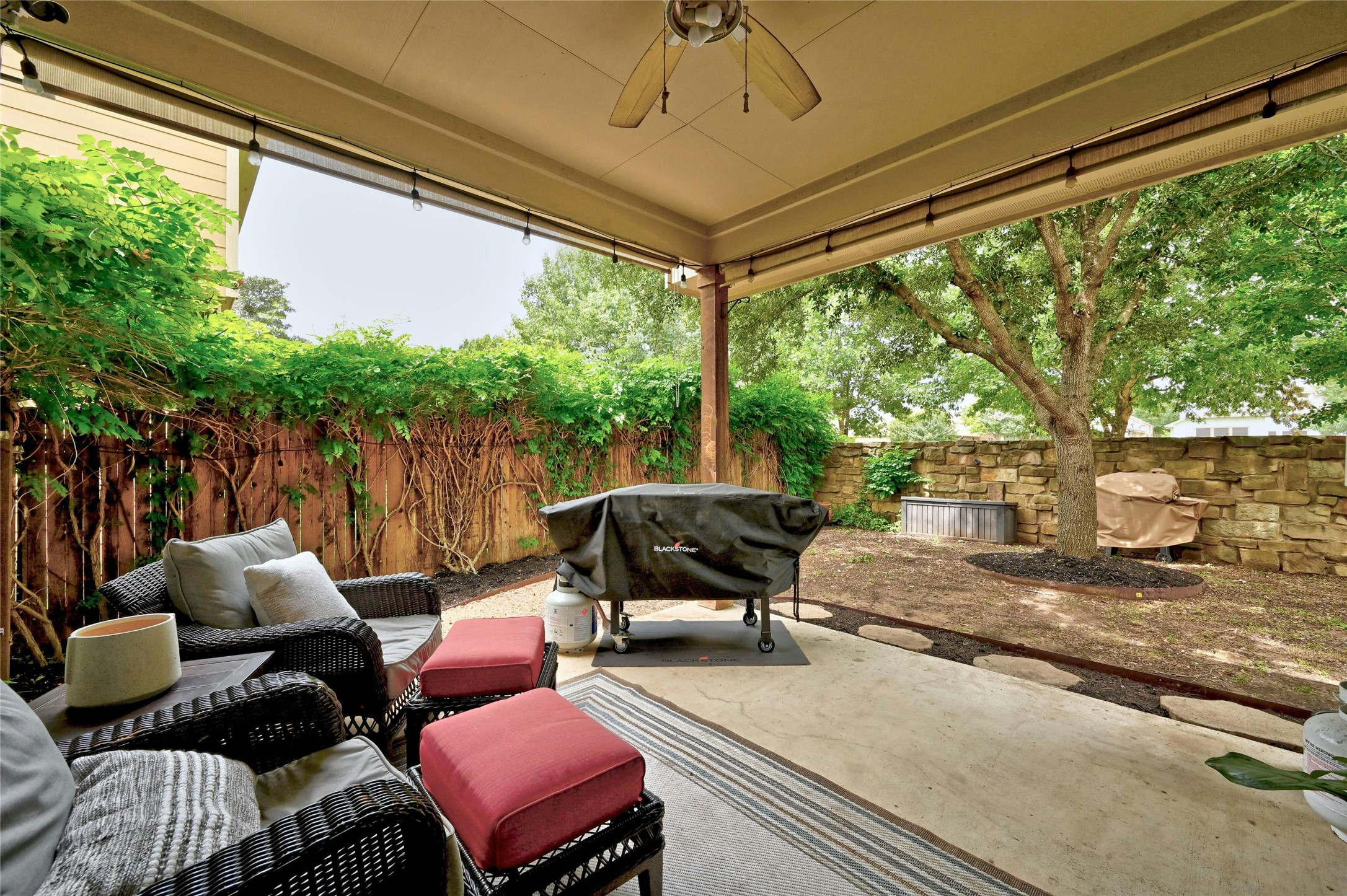 130 Farm House Road San Marcos, TX 78666 - Photo 25 of 34 a outdoor living space with patio furniture and a potted plant