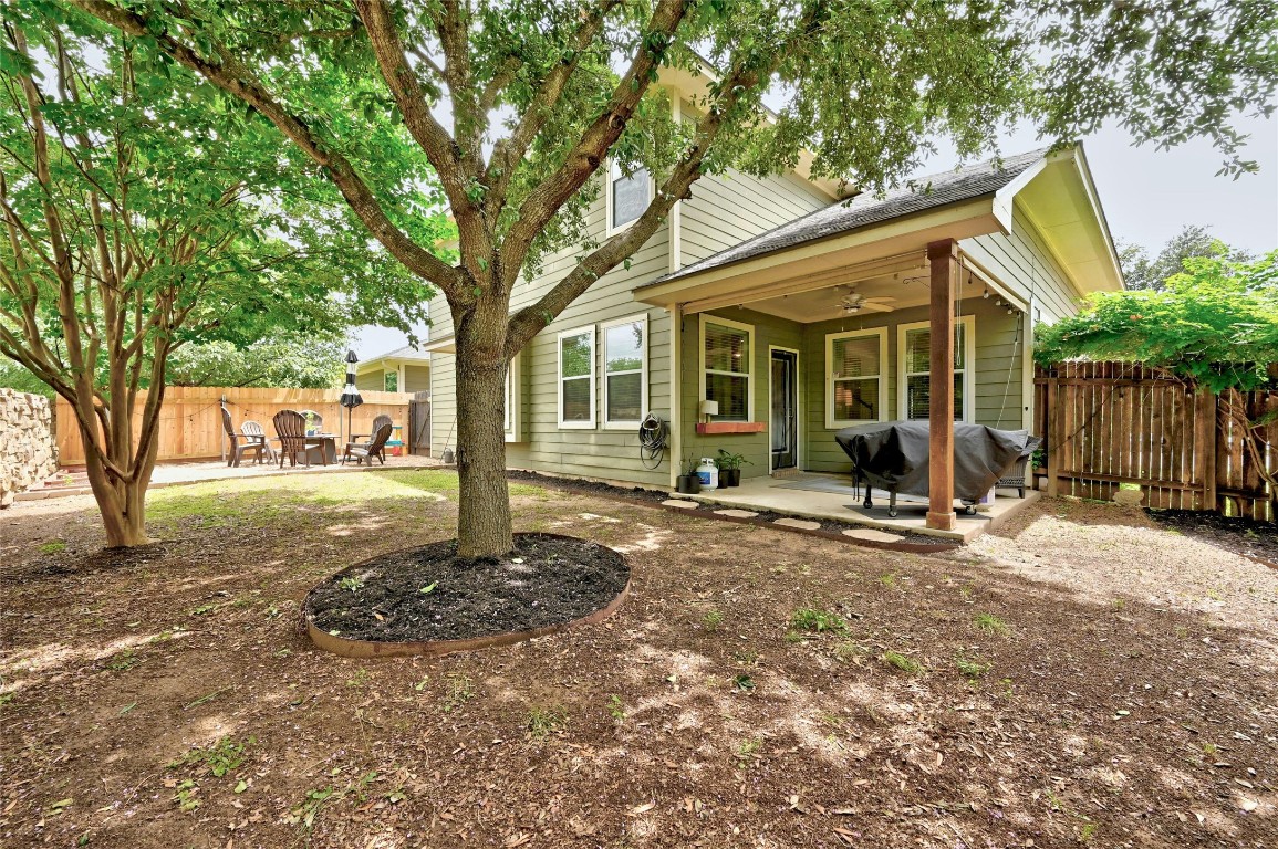 130 Farm House Road San Marcos, TX 78666 - Photo 29 of 35 a view of a house with backyard and a tree
