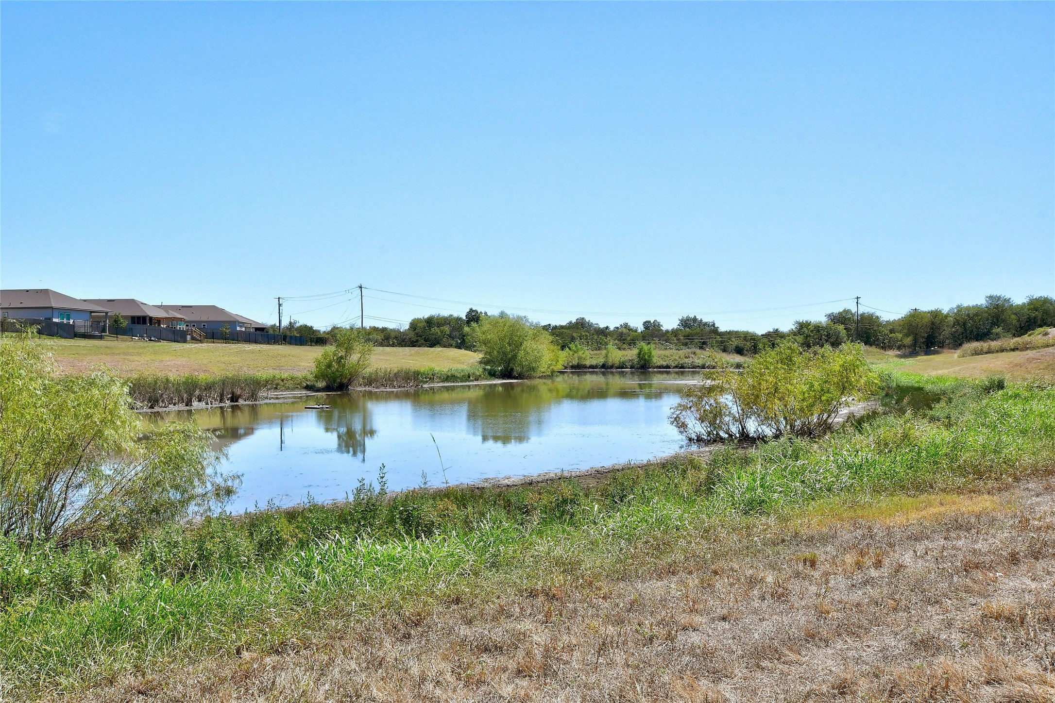 130 Farm House Road San Marcos, TX 78666 - Photo 33 of 34 a view of a lake view with houses in back