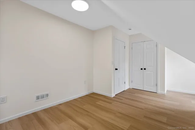 a view of room with wooden floor