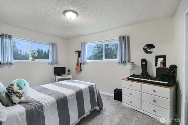 a view of bathroom with washer and dryer