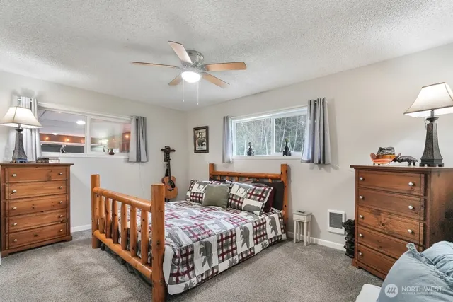 a bedroom with furniture and a window