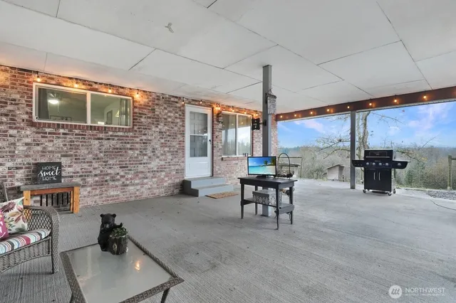 a dining room with furniture and wooden floor