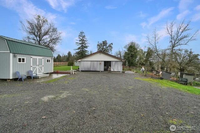 an aerial view of a house with yard