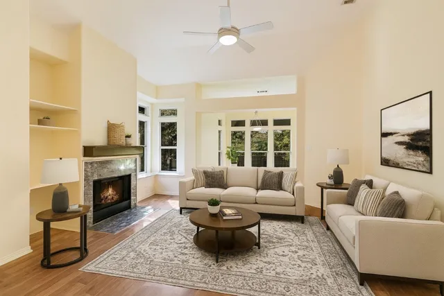 a living room with furniture and a fireplace