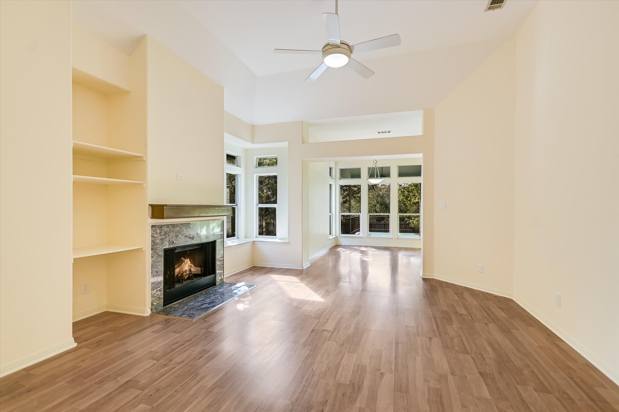 27 Indian Princess Wimberley, TX 78676 - Photo 5 of 25 a view of empty room with wooden floor and fireplace