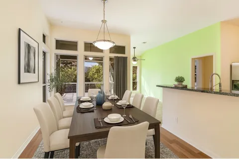 a view of a dining room with furniture window and outside view