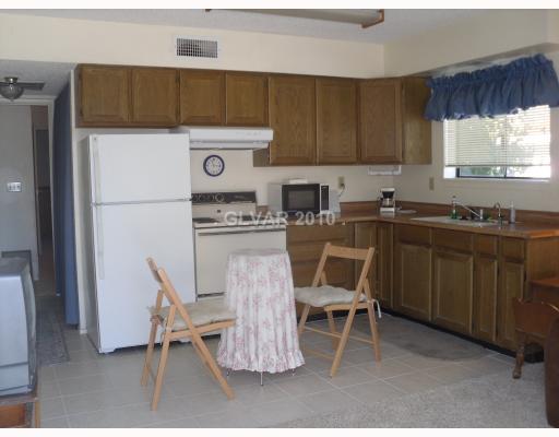 6591 Vigo Road Las Vegas, NV 89146 - Photo 11 of 17 Studio/Study/Office. Casita/guest quarters can be used as an office The casita offers a living area with full kitchen, a nice sized bedroom, full bath, and sotrage room.