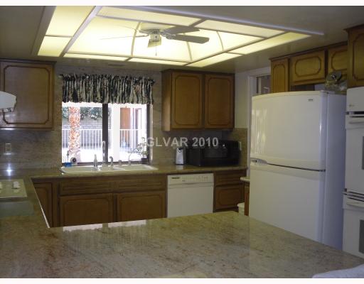6591 Vigo Road Las Vegas, NV 89146 - Photo 15 of 17 Other. Bright and airy kitchen with beautiful granite and plenty of cabinet space.