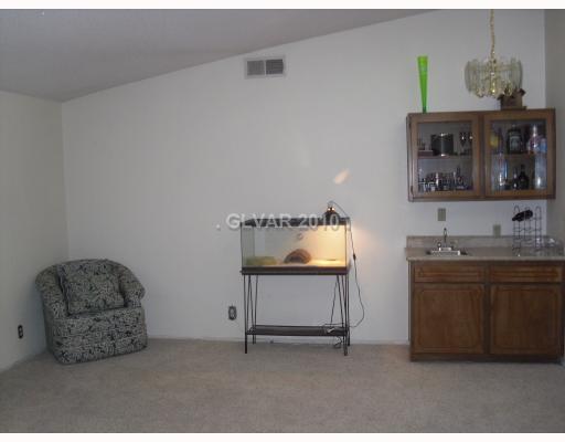 6591 Vigo Road Las Vegas, NV 89146 - Photo 16 of 17 Den. Large family room with wetbar.