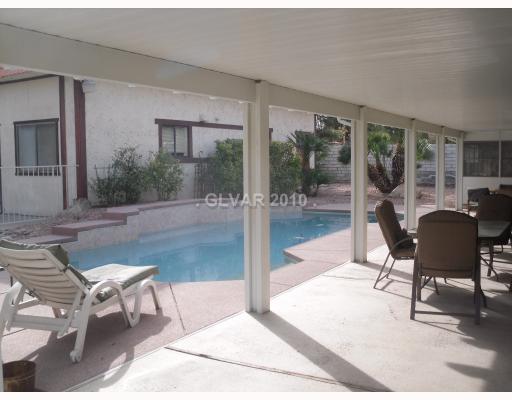 6591 Vigo Road Las Vegas, NV 89146 - Photo 3 of 17 Other. Pebble tech pool with waterfall, covered patio, and plenty of space to entertain!