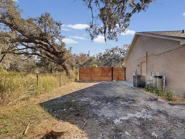 a view of a backyard of the house