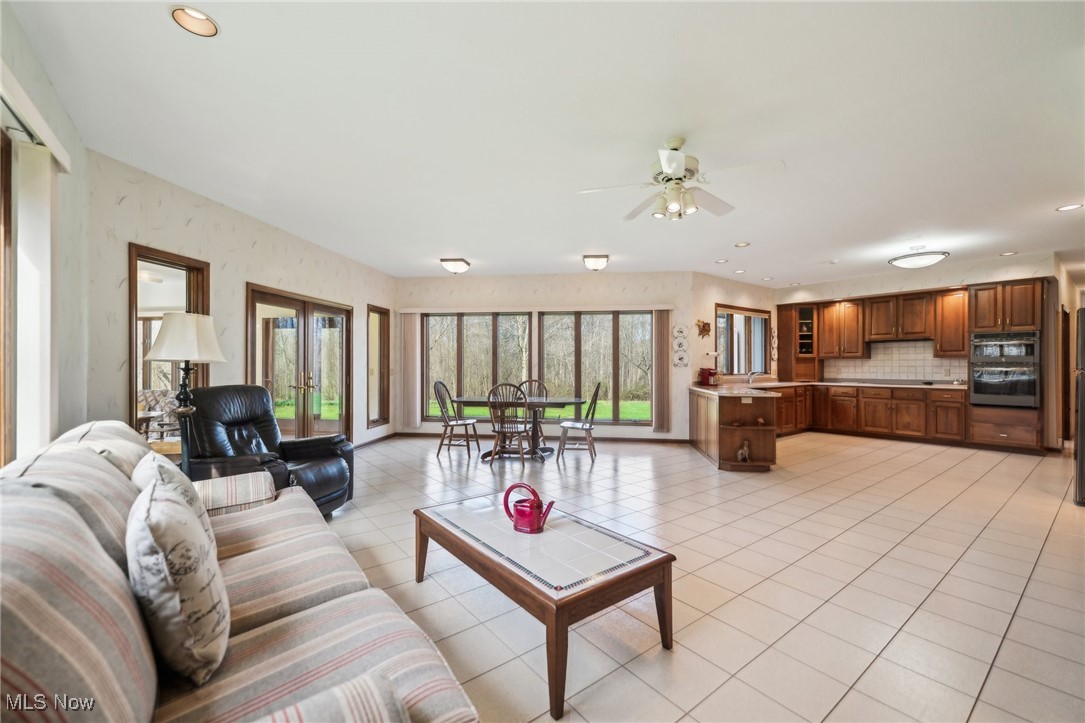 43301 Parsons Road Oberlin, OH 44074 - Photo 14 of 47 Living area with recessed lighting, light tile patterned floors, and a ceiling fan