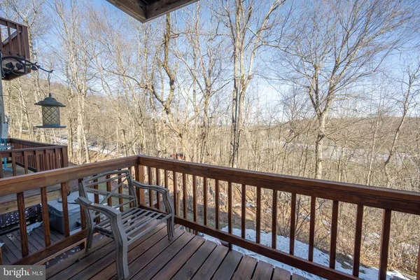 a view of a balcony with wooden fence