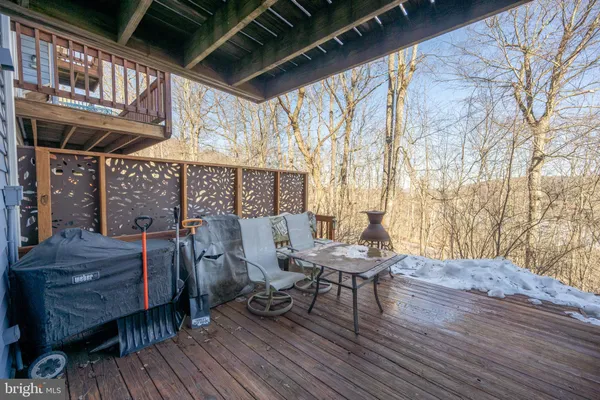 a view of a chairs and table in a patio
