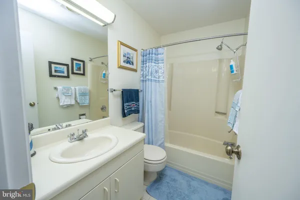 a bedroom with a large bed and a dresser