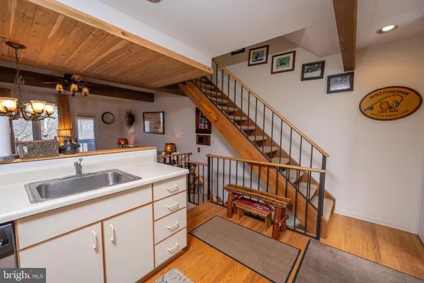 a view of a living room and bedroom with furniture